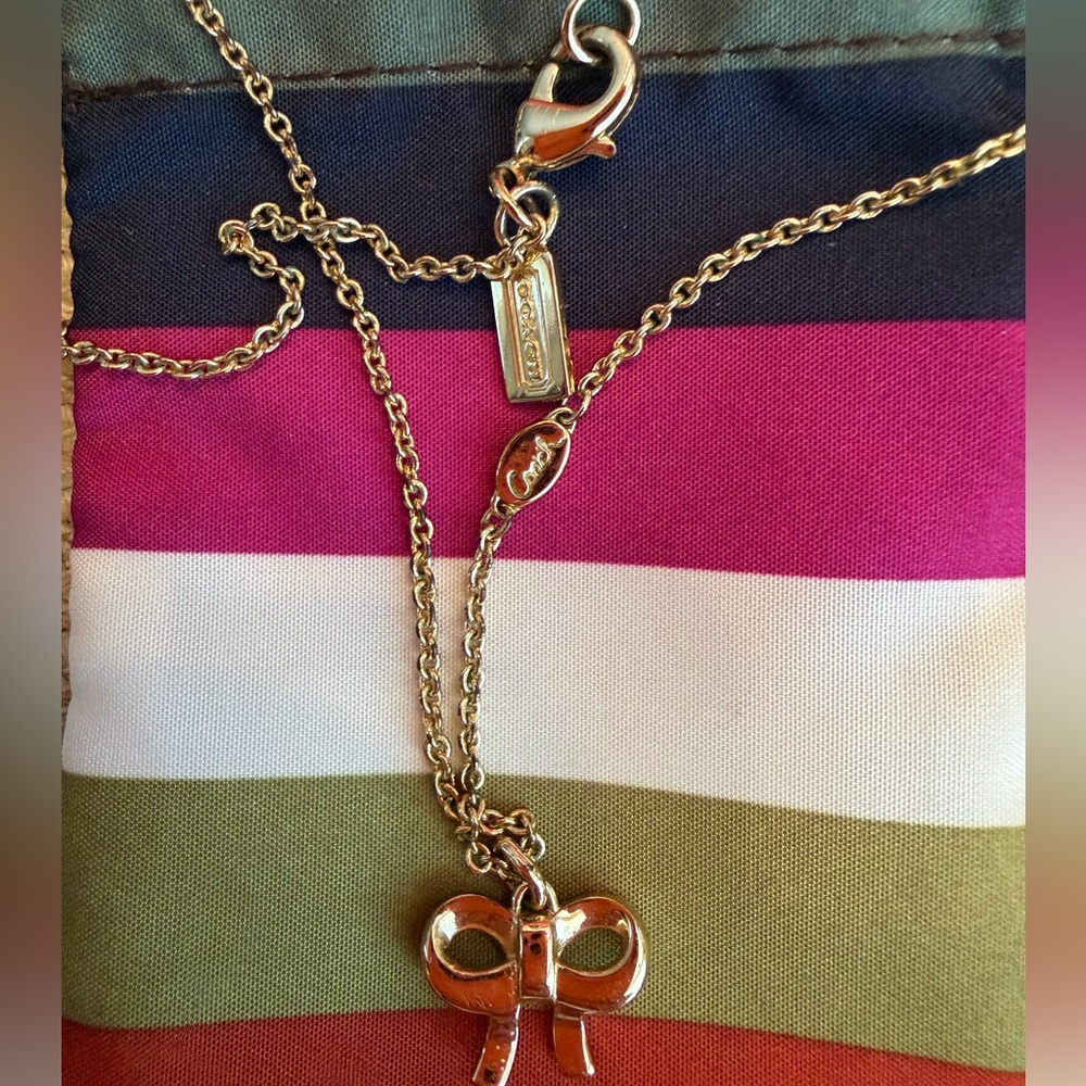 Coach Gold-Tone Crystal Bow Necklace with Legacy Striped Pouch and Coach Logo - Picture 6 of 7